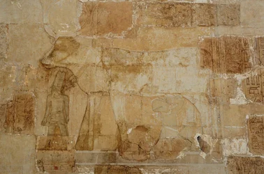 Mortuary Temple of Queen Hatshepsut: Hathor chapel, the goddess in her bovine form, with crown, is fed by Hatshepsut
