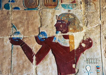 Painted relief of Thutmose offering wine to Sokaris, Mortuary Temple of Hatshepsut, Deir el-Bahari, Luxor, Thebes (Unesco World Heritage List)