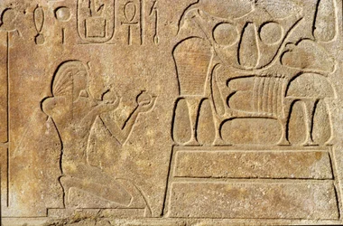 Queen Hatshepsut kneeling before a table of offerings, Temple of Amun, New Kingdom