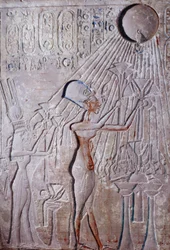 Low relief of King Ikhenaton and Queen Nefertiti adoring the god of the sun Aton
