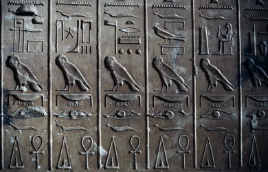 Bas-relief with hieroglyphic reliefs depicting god Horus in form of hawk and ankh