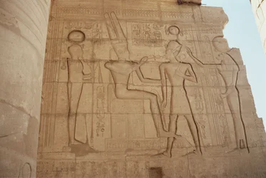 Relief depicting the lioness-headed goddess Mut presenting Ramesses II to an enthroned Amun, who gives him an ankh, from the Great Hypostyle Hall
