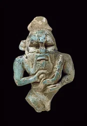 Faience Amulet of Bes Nursing a Horus