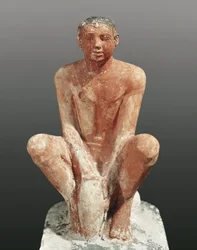 Egyptian civilization, painted limestone statue depicting man modeling clay