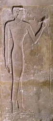 Pillar Depicting a Woman Smelling a Lotus Flower