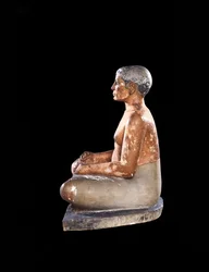 Wide view of Crouching Scribe Statue, from Saqqara, Old Kingdom