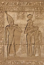 Egyptian Antiquity: Roman Mammisi Commemorating the Birth of Ihy, Son of Hathor - Detail of Reliefs and Hieroglyphs: the Goddess Isis - Hathor Nursing Her Son Ihi (Ihy) and Behind Her Another Image of Ihi with a Finger in Her Mouth Indicating that it is a 