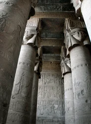 Partial view of the hypostyle room with columns decorated with the representation of the goddess Hathor. Temple of Hathor, Denderah, Egypt