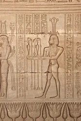 Egyptian antiquity: representation of a man bringing offerings as homage to the goddess, Temple of Hathor, Denderah, Egypt