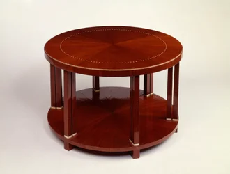 A low round twin level table with rosewood veneer, inlaid with ivory