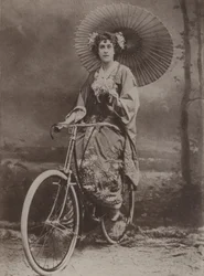 Girl on bicycle, dressed in the Japanese fashion