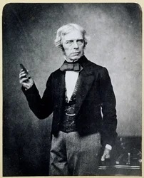Michael Faraday holding a Bar Magnet