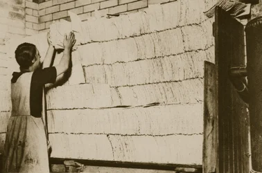 Stacking unleavened bread for the Passover in a Hebrew bakery