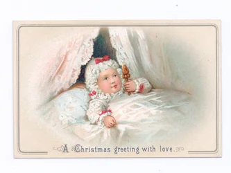 Victorian Christmas Card of a Child in Bed Holding a Rattle, c.1880