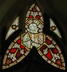 A north window depicting the Trinity