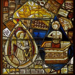 A panel in the east window depicting Christ of Pity rising from the tomb, a musician angel with a harp, and St Mark