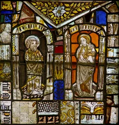 A panel in the east window depicting St Peter and St John with the Gromwell weed above
