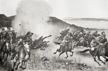 A shell from the Naval Brigade dispersing Boers from behind the Seven Sisters Kojes during the action of the 7th March