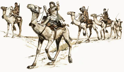 Arabs crossing the desert on camels