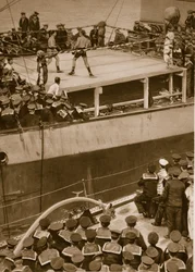 Boxing competition aboard a warship, with the crew of a second ship as additional spectators