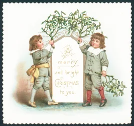 Boys hanging mistletoe to sign