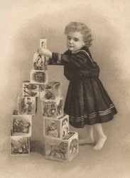 Child stacking building blocks