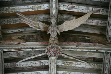 View of one of the carved wooden angels in the nave