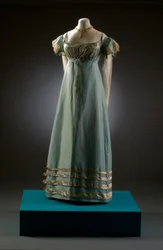 Duck egg blue evening dress with cream sleeves, shown here with pearl jewellery, c.1819