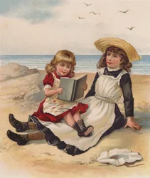 Girls reading on a beach