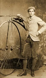 Man standing next to his Penny-Farthing, c.1890