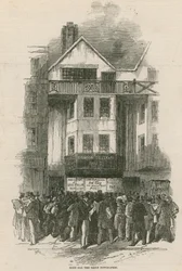 Rush for the daily newspaper at the office of the Daily Telegraph