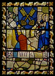 The east window depicting St John, St Peter at the Gate, shield with a symbol of St Peter