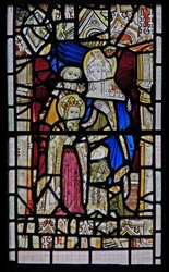 Window Ew depicting St Anne, Joachim, the Virgin Mary and the Christ Child