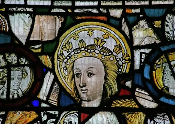 Window NW depicting a female head, crowned and sainted