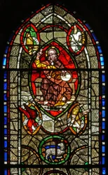 Window depicting Christ in Majesty surrounded by Evangelist symbols