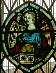 Window depicting an angel playing a harp