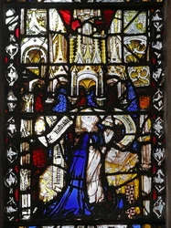 Window n4 depicting a cleric with scroll