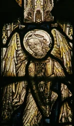 Window depicting a musician angel with a harp