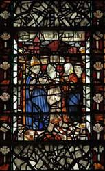 Window W58 depicting St Thomas Becket with a prisoner and 2 other figures