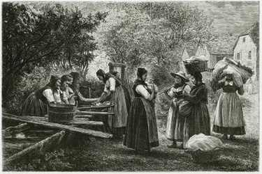 A laundry in Metzeral, women wearing traditional vallee costumes gather at the village fountain. Engraving to illustrate the story 
