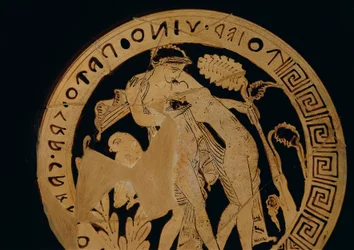 Red-figure kylix (wine pottery) depicting youngsters embracing, inscribed with an invitation to drink, circa 350 B.C.