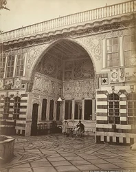 Interior of a Jewish House in Stambouli, Syria. Two Women are Shown Under a Portico