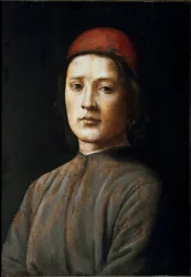 Portrait of a young man with a red hat