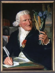 Parmentier holding the potato and the potato flower