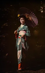 Japanese woman holding parasol and wearing kimono, early color autochrome, circa 1916