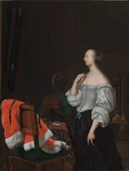 A Woman Standing Before a Mirror