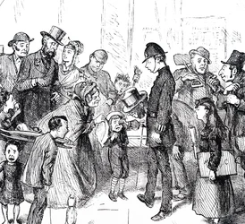 A policeman and passers-by trying to help a lost child