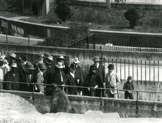 Sir Peter Chalmers Mitchell with Ethiopian Regent Haile Selassie and his entourage viewing a Brown Bear at London Zoo, 1924
