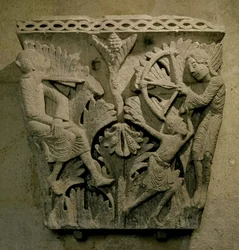 Capital Depicting a Man Shooting an Arrow into the Neck of Another