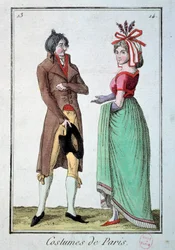 Fashion under the directory: a couple of elegant, the woman wears a hat at the gardener